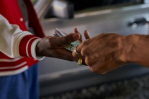 pappas holds cash — Photo by cottonbro studio on Pexels